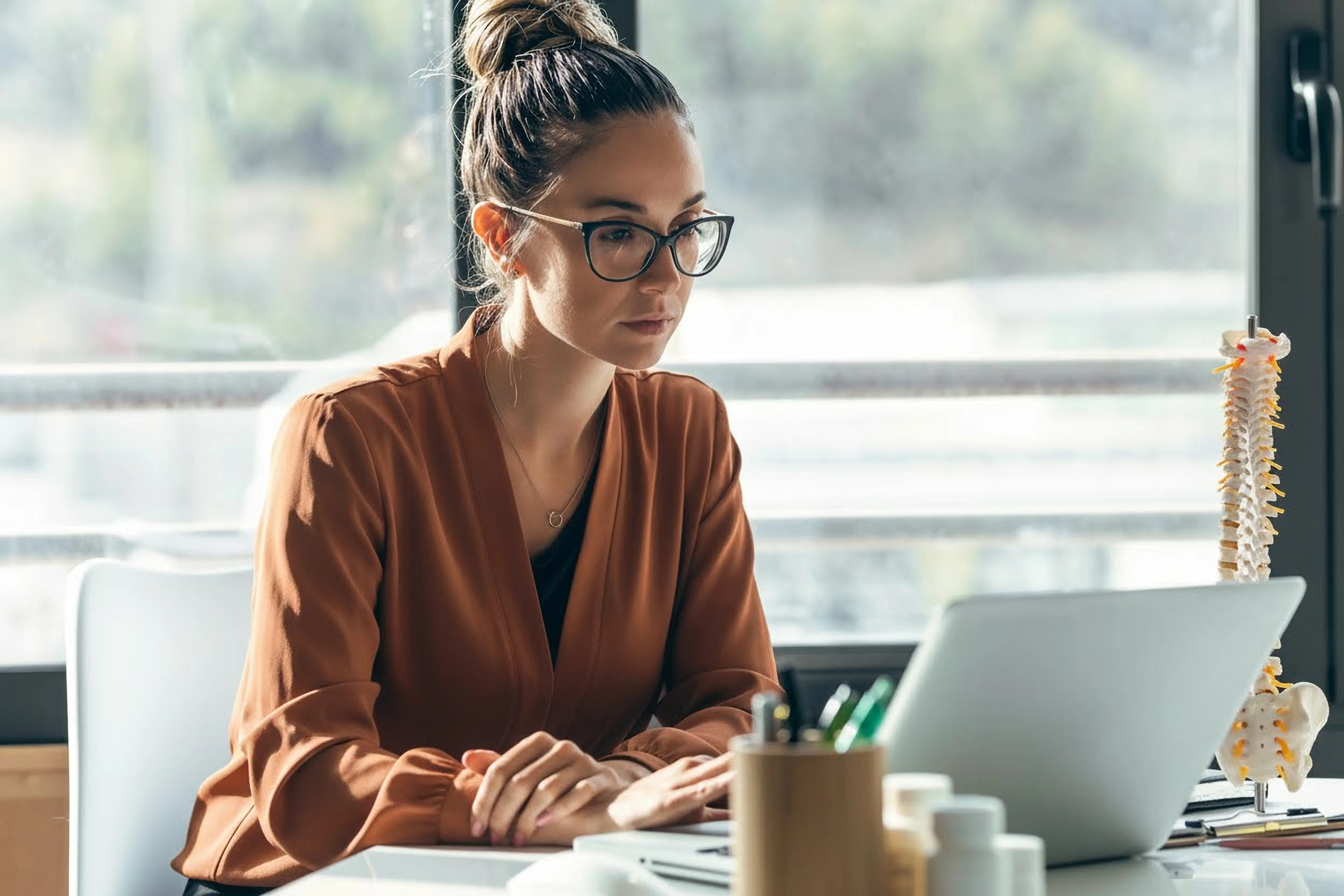 Chiropractor using practice management software